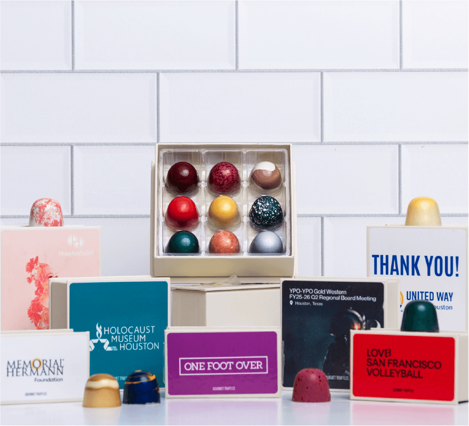 Gourmet gift box filled with Winfield's Chocolate Bar products, including chocolate covered nuts, coffee, and truffles.